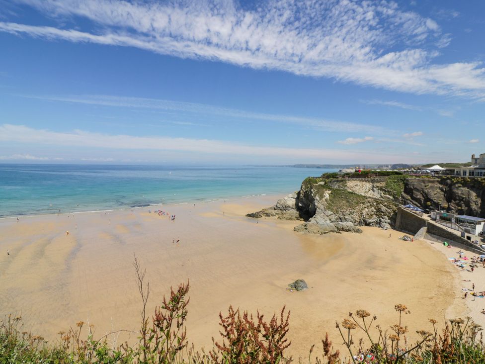 A beach with a view of the ocean and cliff at Penthouse No.3 in Newquay
