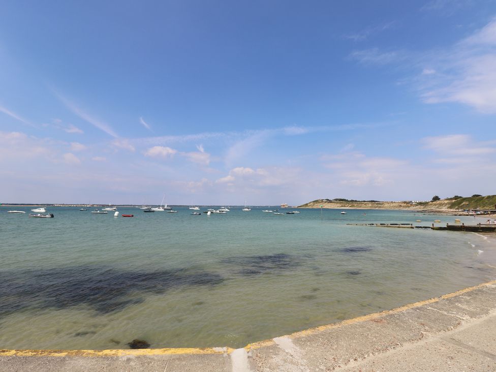 A view of boats on the water at 57 Cliff End Freshwater
