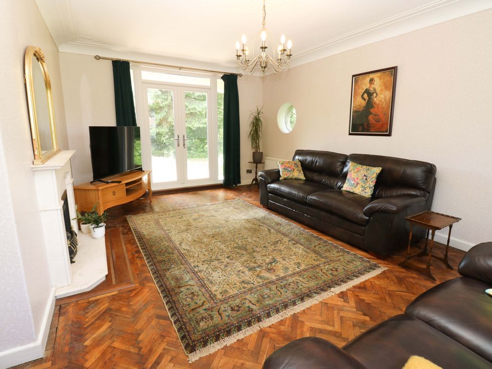 A living room with a sofa and television at 331 Coniscliffe Road, Darlington