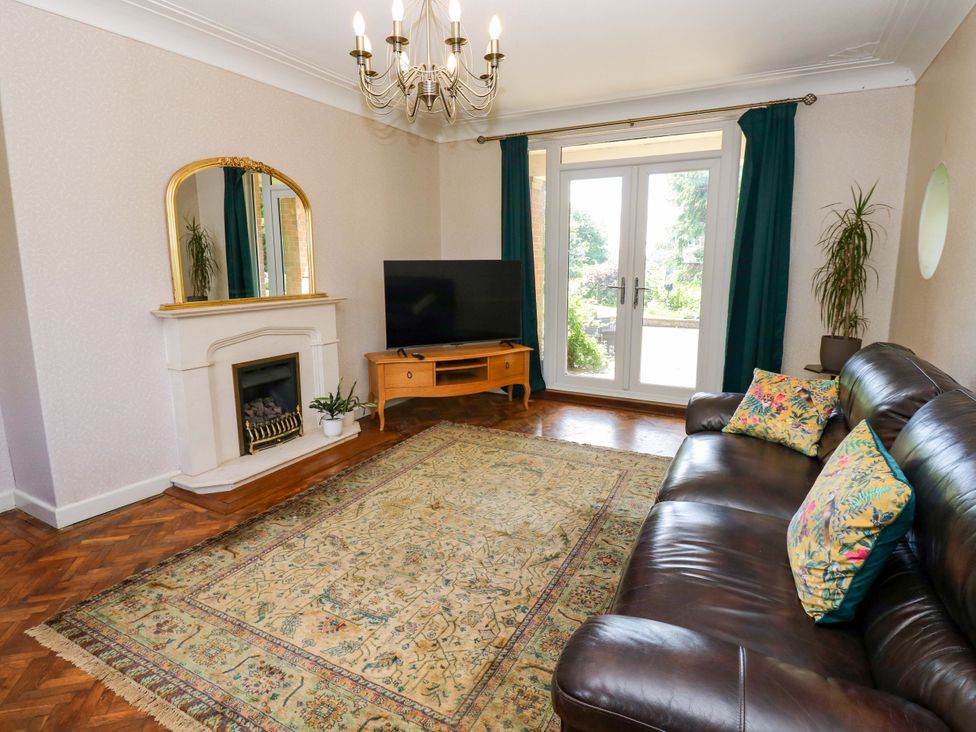 A living room with a sofa and television at 331 Coniscliffe Road in Darlington