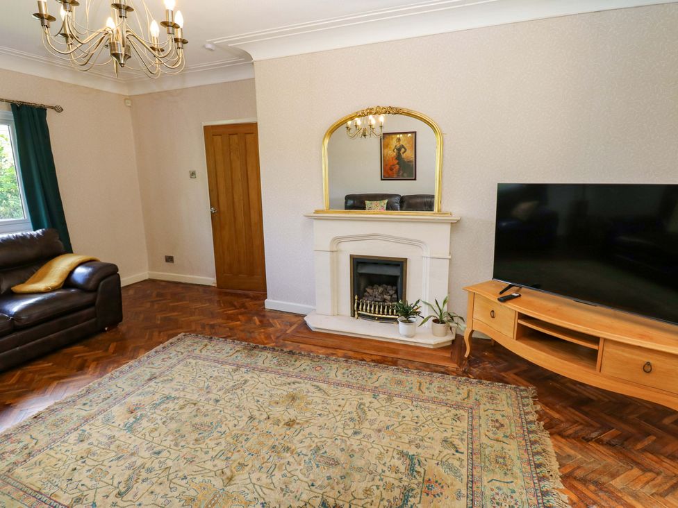 A living room with a sofa and television at 331 Coniscliffe Road in Darlington