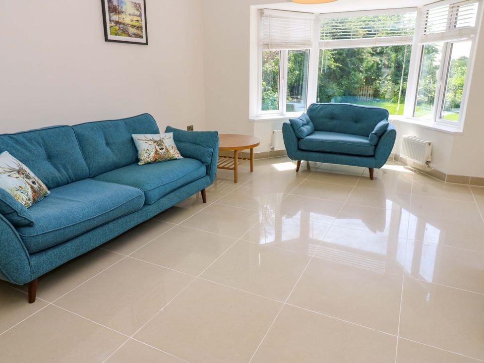 A living room with blue furniture at 331 Coniscliffe Road, Darlington