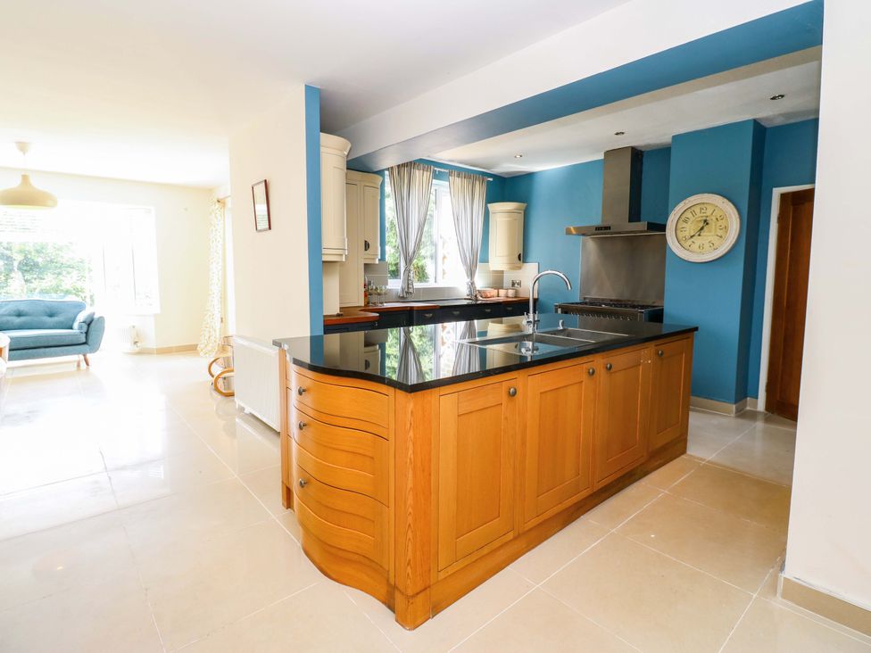 A kitchen featuring an island, stove, and window at 331 Coniscliffe Road in Darlington