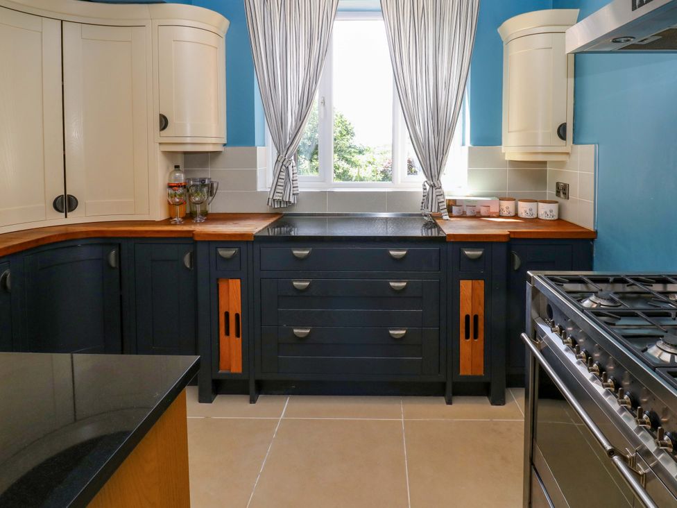 A kitchen with cabinets, countertop, and stove at 331 Coniscliffe Road in Darlington