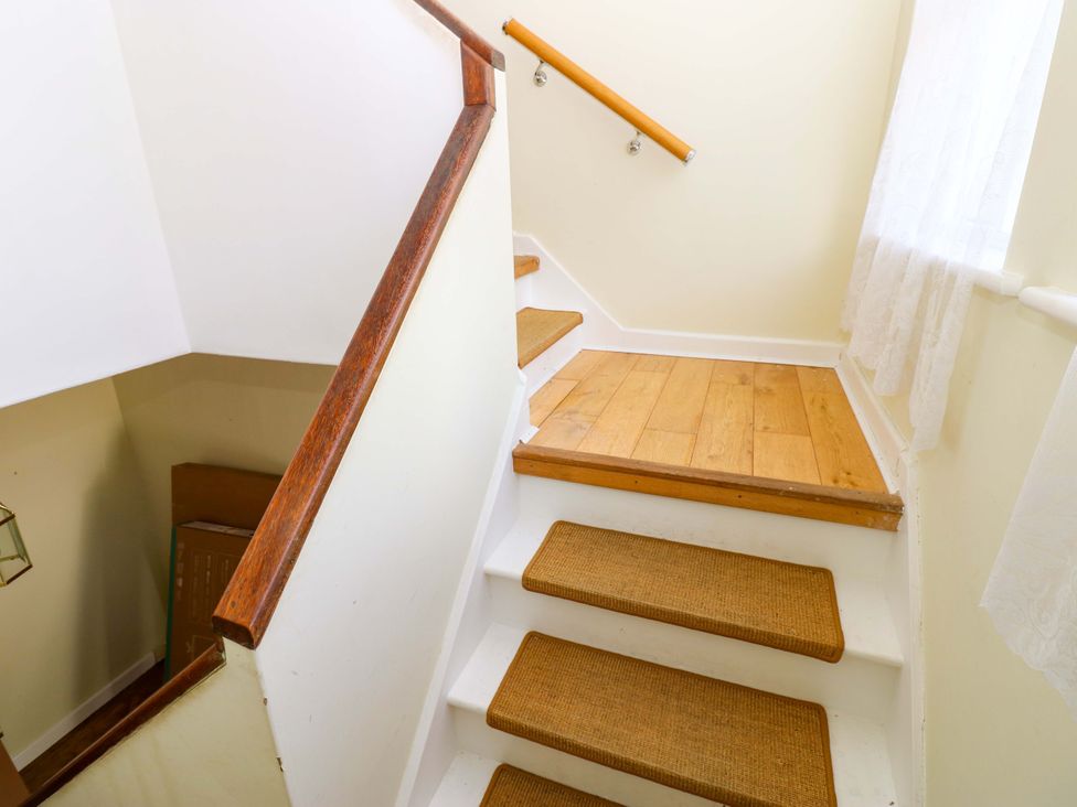 A staircase with wooden steps and handrail at 331 Coniscliffe Road Darlington