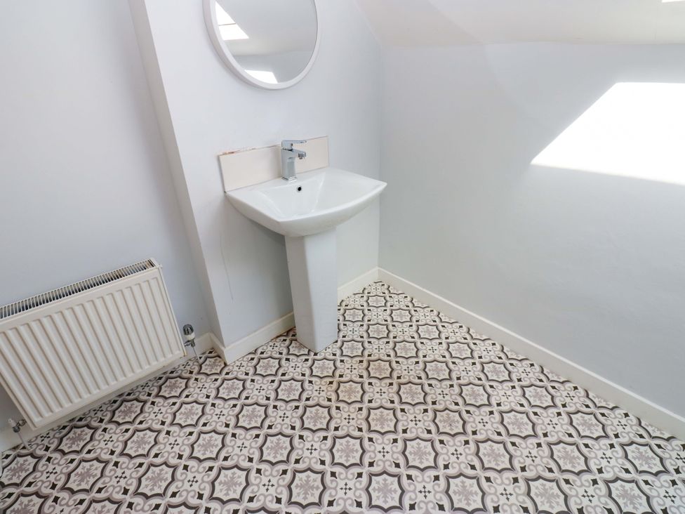 A bathroom with sink and mirror at 331 Coniscliffe Road Darlington