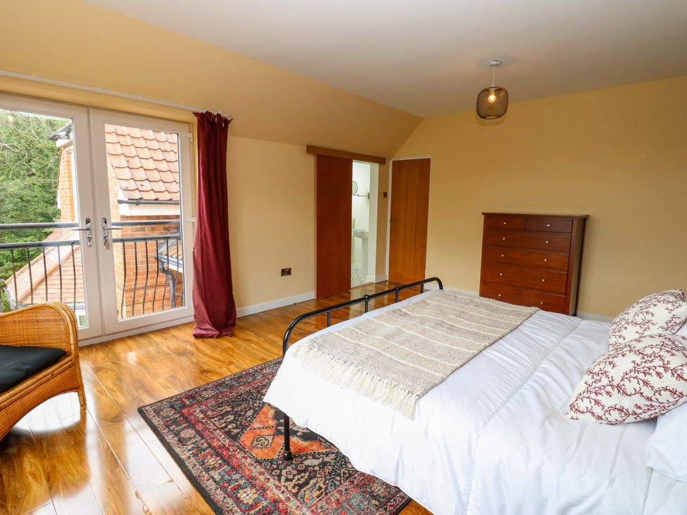 A bedroom with a bed and dresser at 331 Coniscliffe Road in Darlington