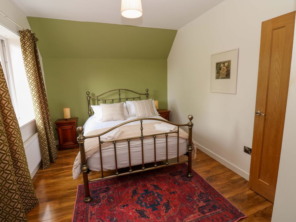 A bedroom with a bed and nightstand at 331 Coniscliffe Road in Darlington