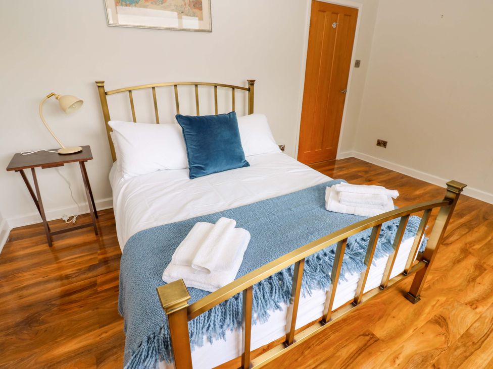 A bedroom with a bed and a bedside table at 331 Coniscliffe Road in Darlington