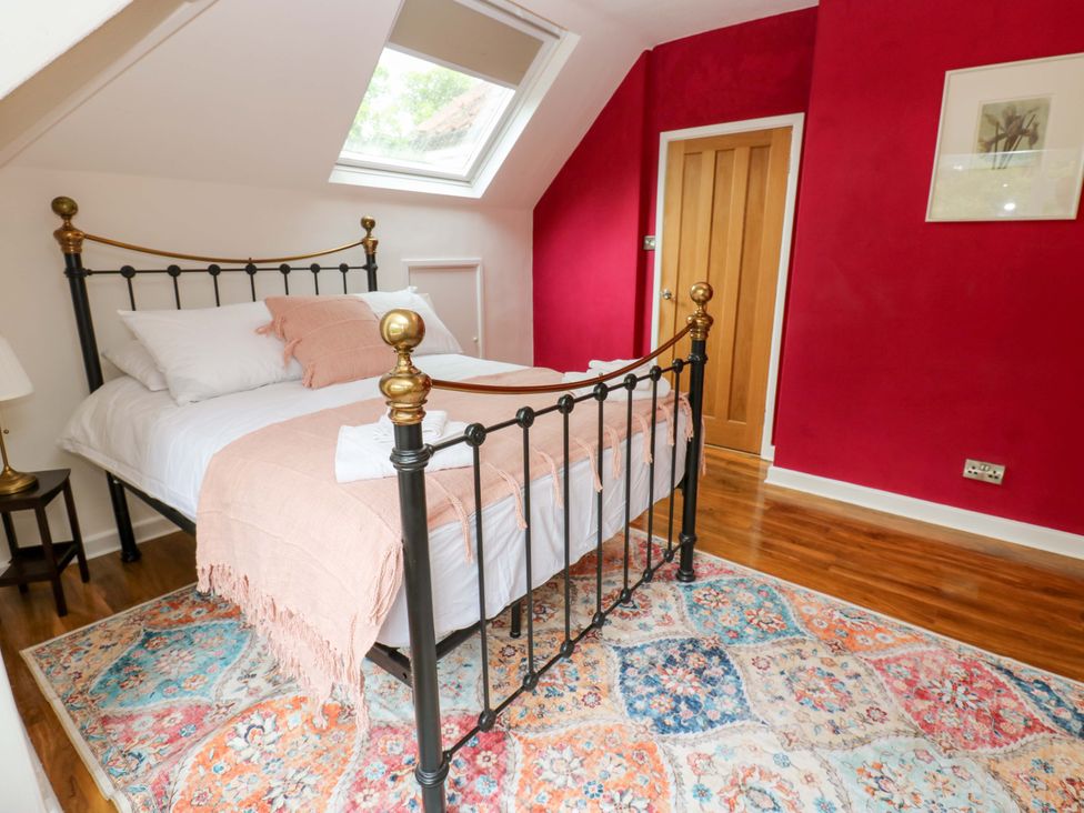 A bedroom with a bed and a rug at 331 Coniscliffe Road in Darlington