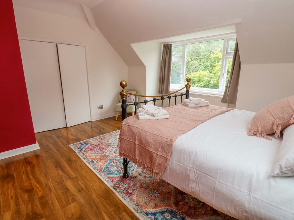 A bedroom with a bed and a wardrobe at 331 Coniscliffe Road in Darlington