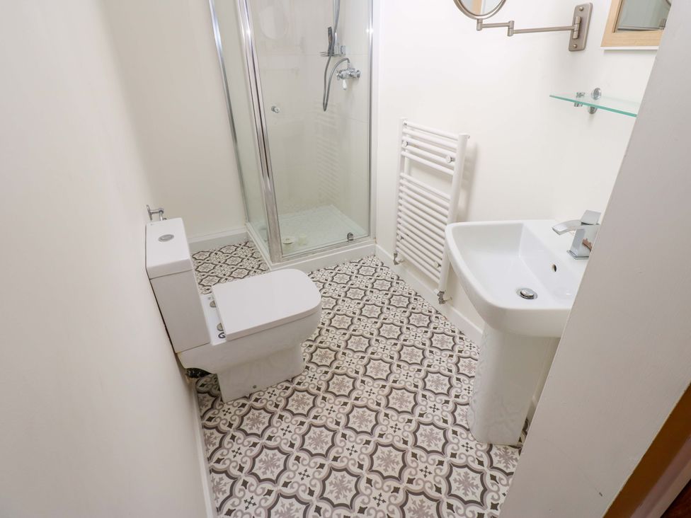 A bathroom with a shower, toilet, and sink at 331 Coniscliffe Road in Darlington