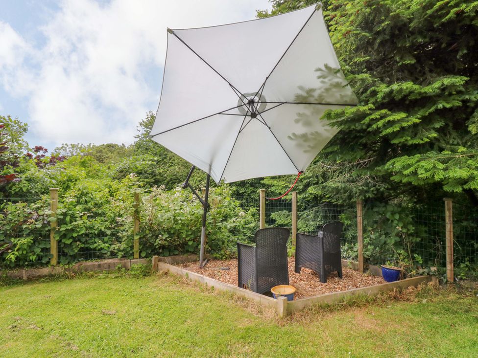 A garden with chairs and an umbrella at 331 Coniscliffe Road in Darlington