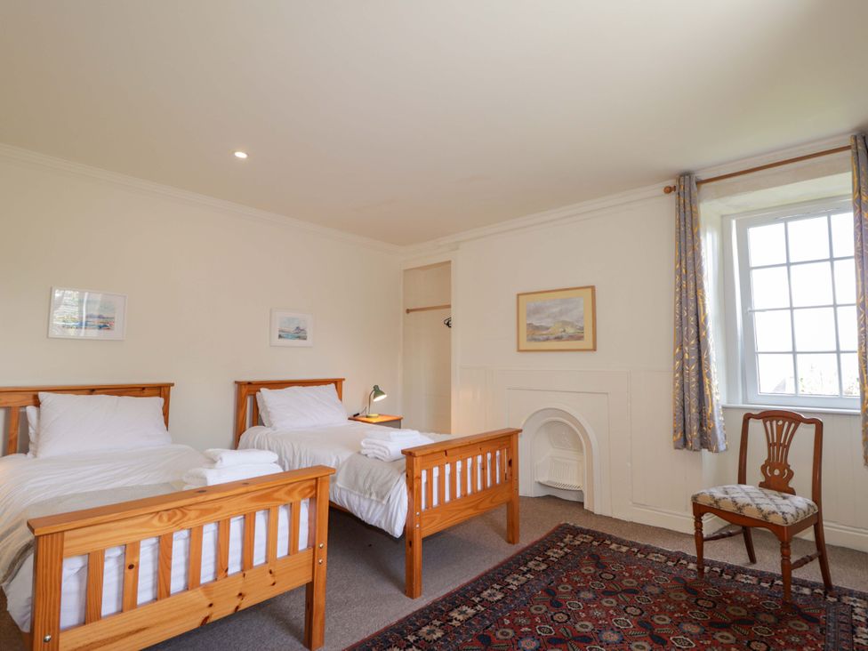 A bedroom with two beds and a window at 6 Hill Street in 