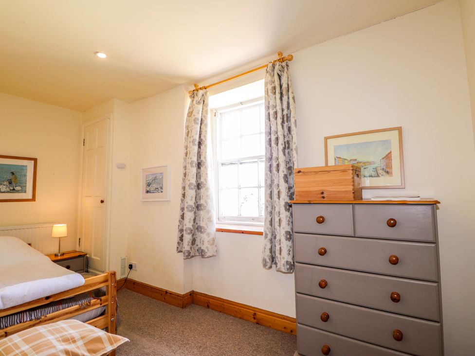 A bedroom with a bed and furniture at 6 Hill Street