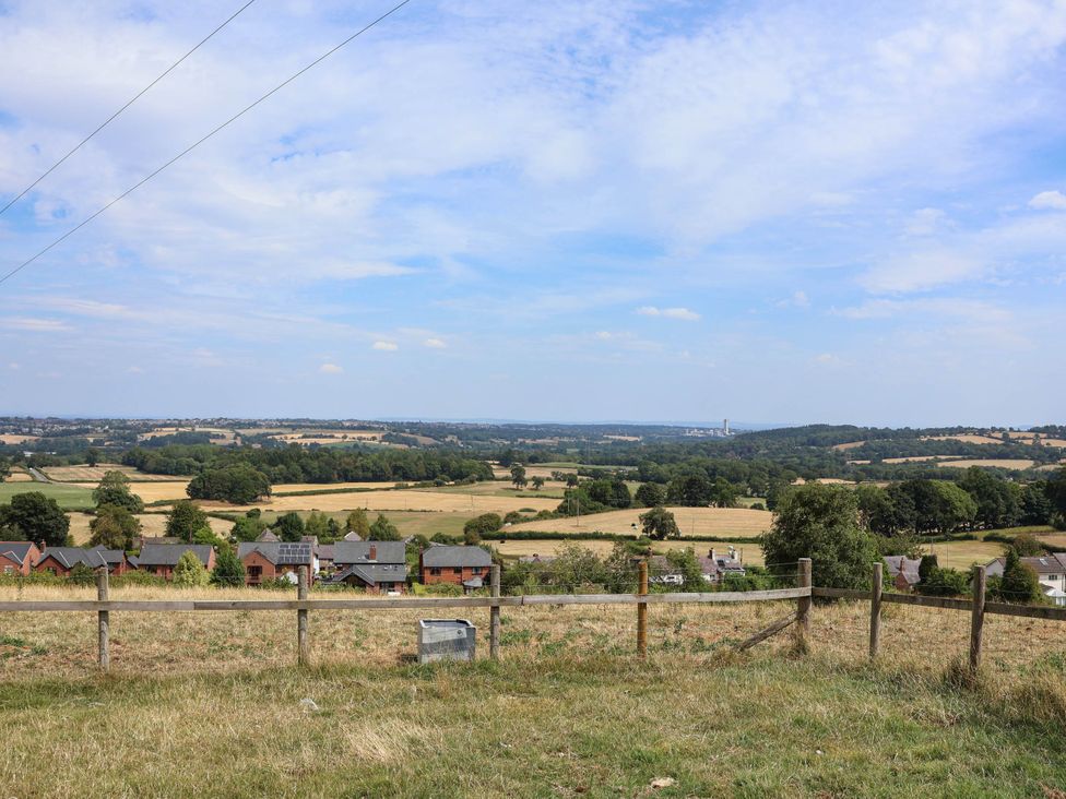 A view of houses and fields under a blue sky at Balwen in Nercwys near Mold