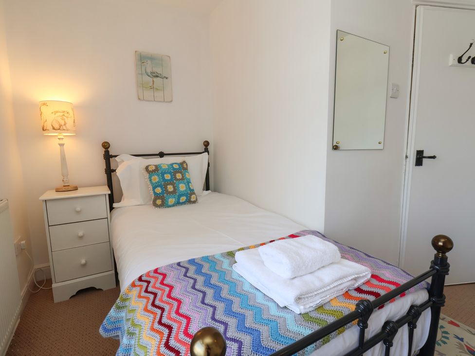 A bedroom with a single bed and a nightstand at 4 Studley Terrace in Whitby