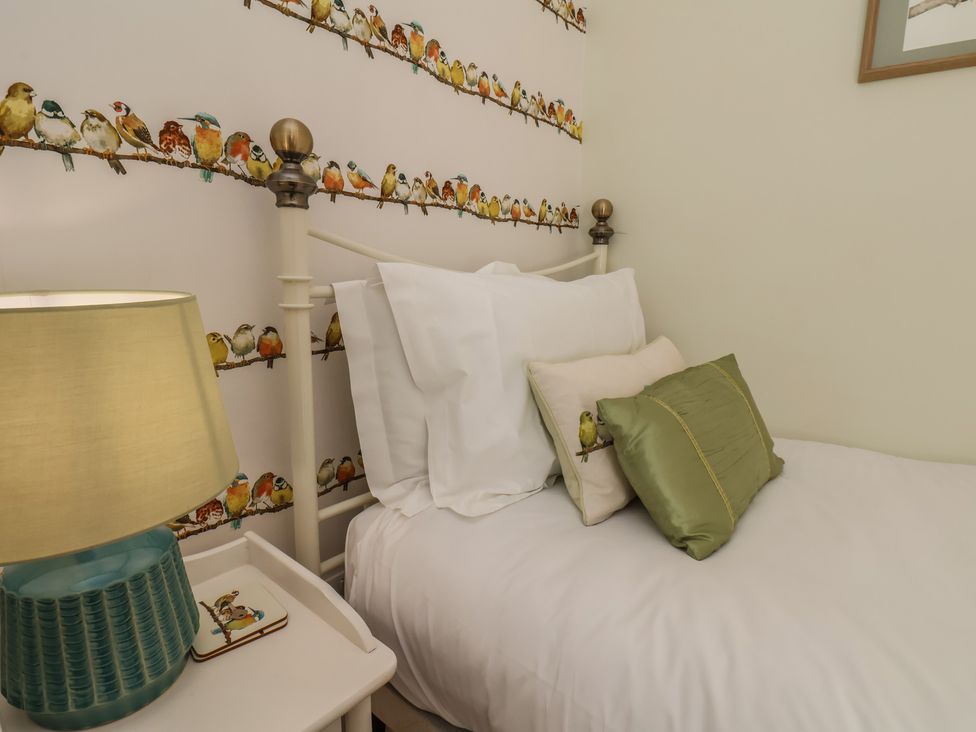 A bedroom with a bed and lamp at 4 Studley Terrace in Whitby