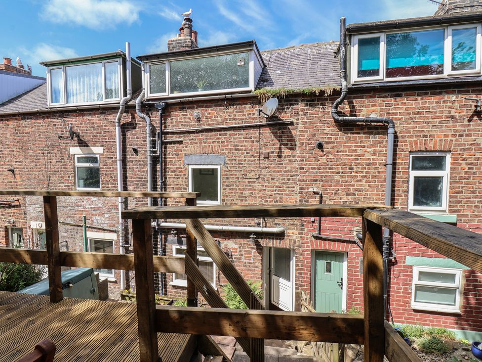 A view of buildings with a wooden deck at 4 Studley Terrace Whitby