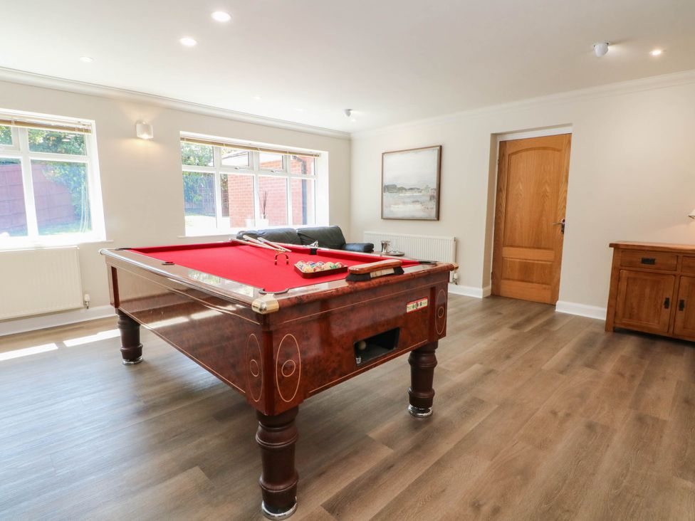 A snug with a pool table and seating area at The Ferns in Kirkham
