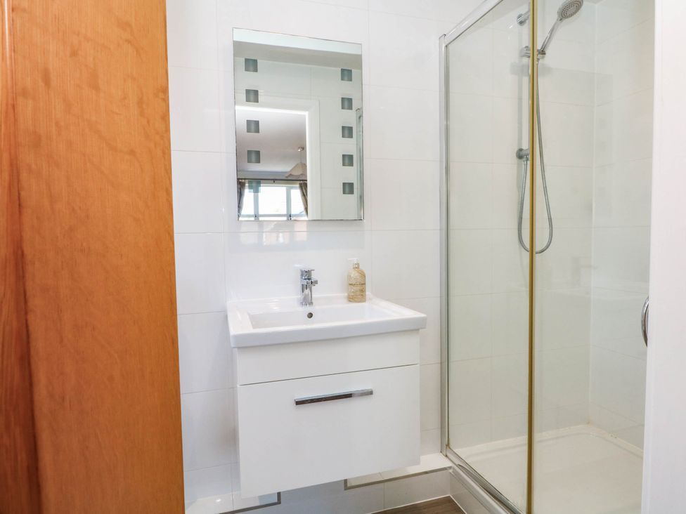 A bathroom with a shower and sink at The Ferns in Kirkham