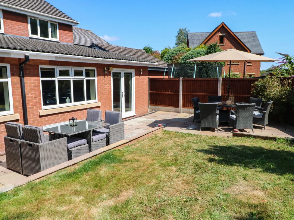 A garden with patio furniture and grass at The Ferns in Kirkham