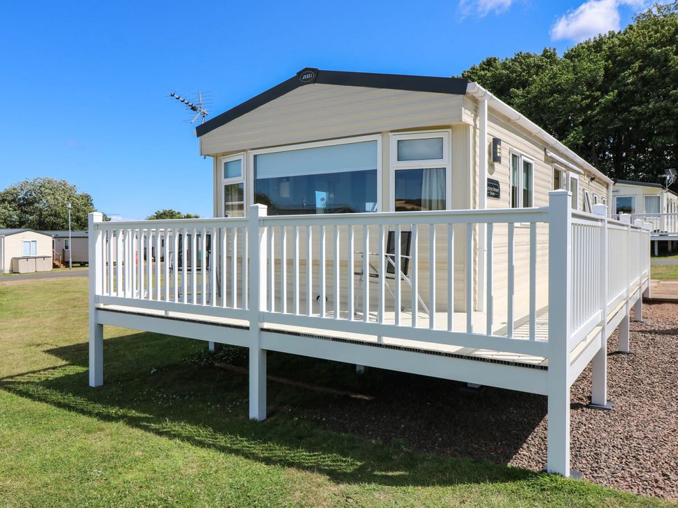 A mobile home with a decking area at Rowan View 251