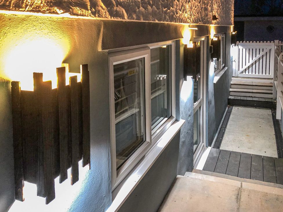 An outdoor pathway with lights and stairs at The Hideaways in Tyn-y-Gongl