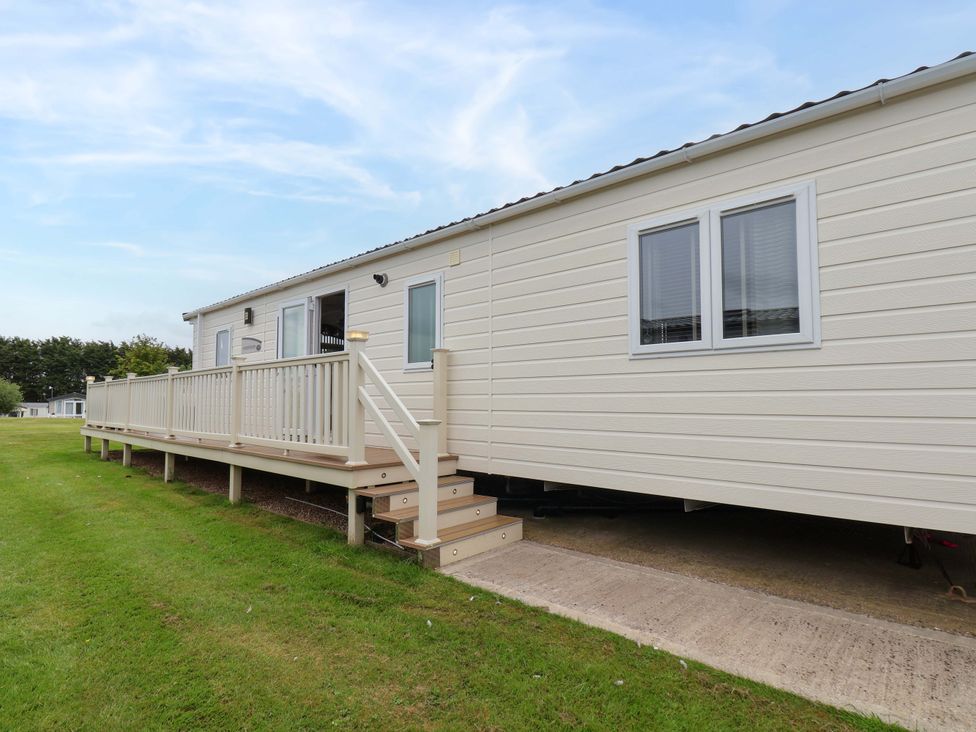 A mobile home with steps and a deck at Finch 66 in Scarborough