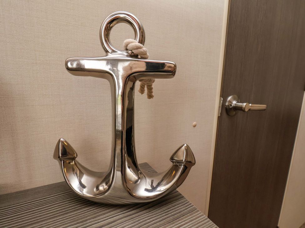 A decorative anchor on a table near a door at Finch 66 in Scarborough