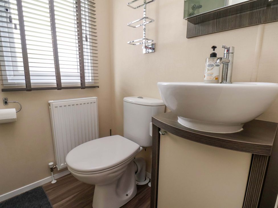 A bathroom featuring a sink and toilet at Finch 66 in Scarborough