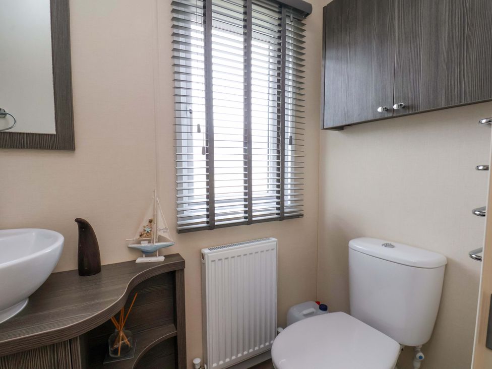 A bathroom with a sink and toilet at Finch 66 Scarborough