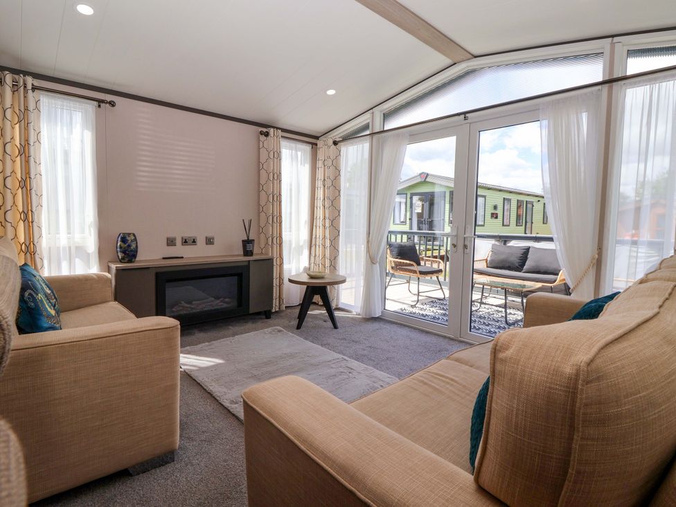 A living room with a sofa and coffee table at Lodge - Plot 18 near Sherburn