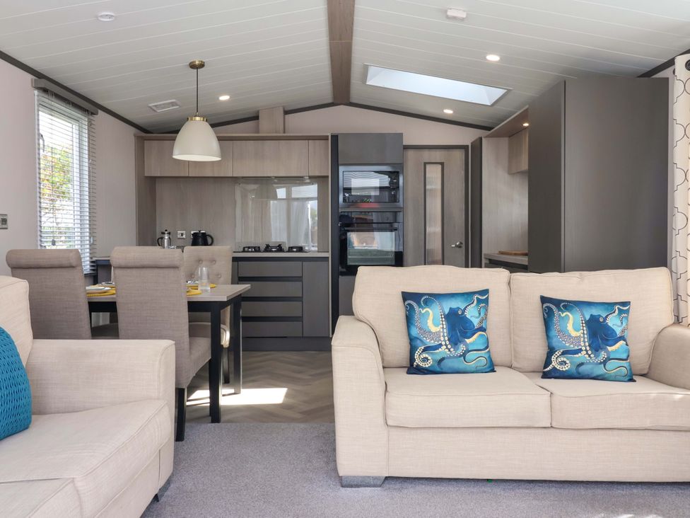 A living room with a dining area and kitchen in Lodge - Plot 18 Near Sherburn