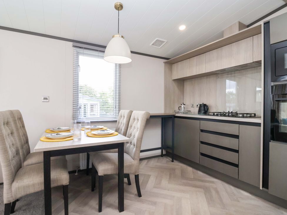 A kitchen with table and chairs at Lodge - Plot 18 Near Sherburn