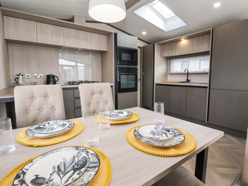 A kitchen with a dining table and chairs at Lodge - Plot 18 Near Sherburn