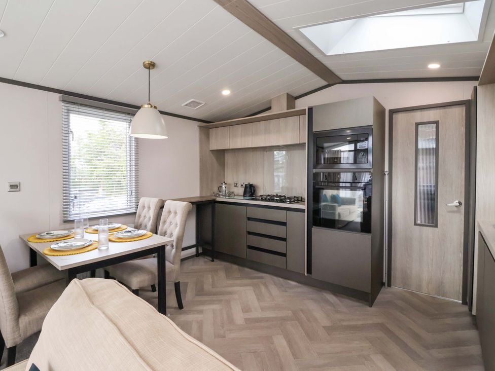 A kitchen with table and chairs at Lodge - Plot 18 Near Sherburn