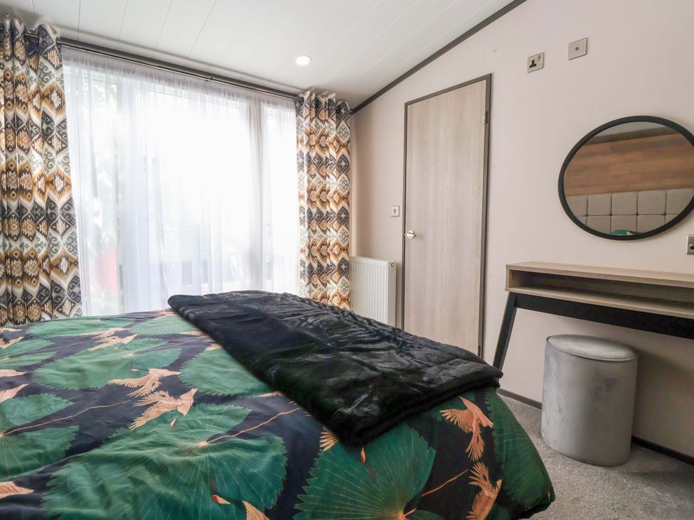 A bedroom with bed and window at Lodge - Plot 18 Near Sherburn
