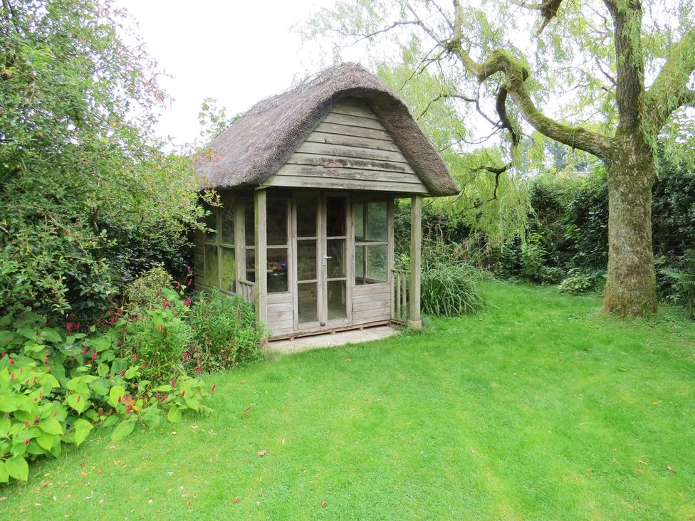 A wooden shed in a garden at Little Owl High Cross near Petersfield
