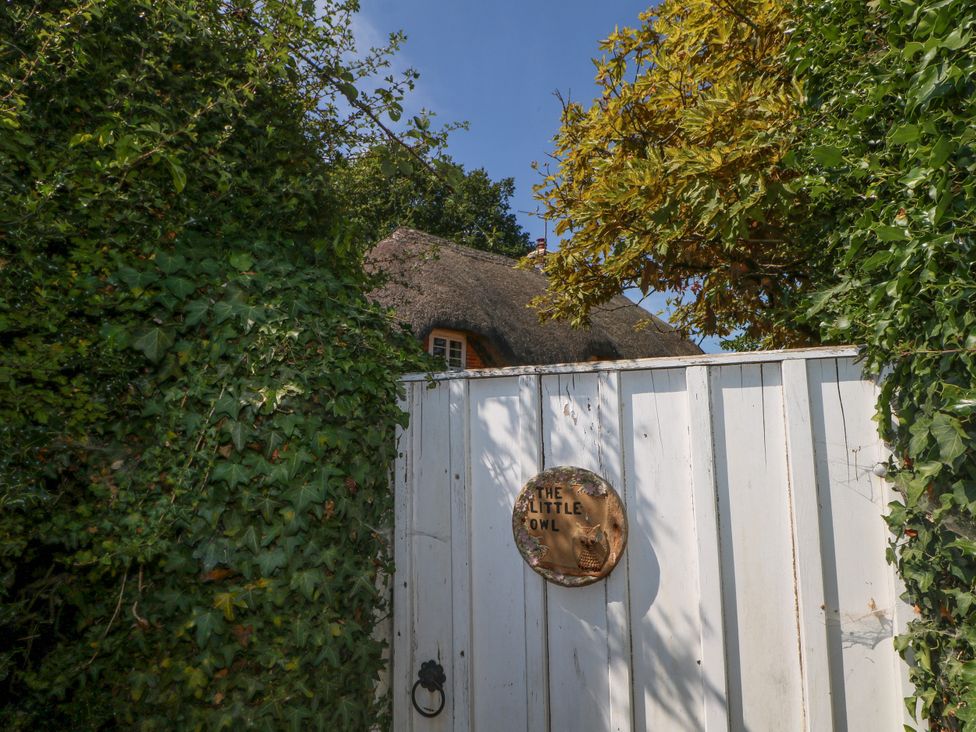 A gate with a sign at The Little Owl in High Cross near Petersfield