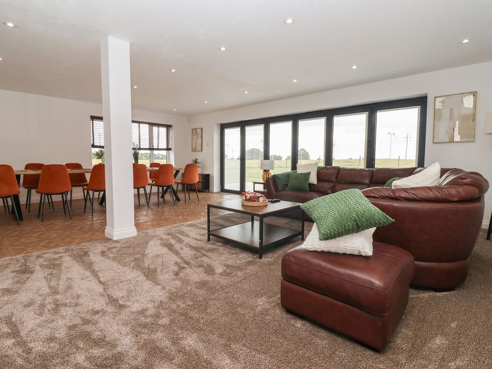 A living room with a sofa and coffee table at Gravel Pit Cottage in Bridlington