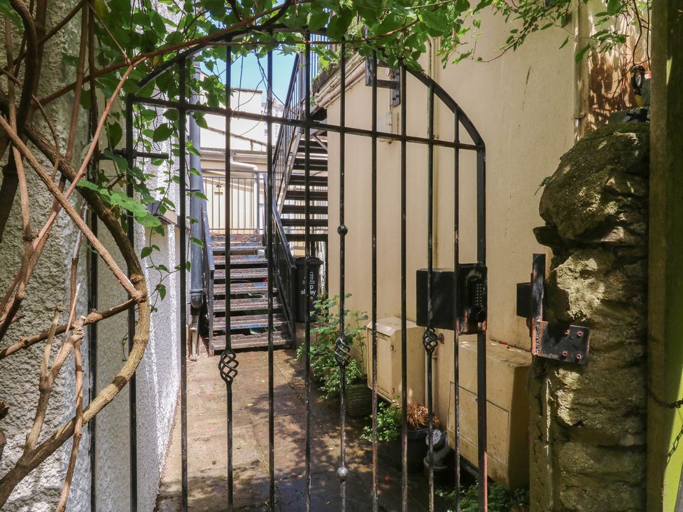 A pathway with a gate leading to stairs at 15D Foss Street in Dartmouth