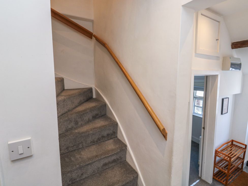 A staircase leading up with a handrail in a hallway at 15D Foss Street Dartmouth