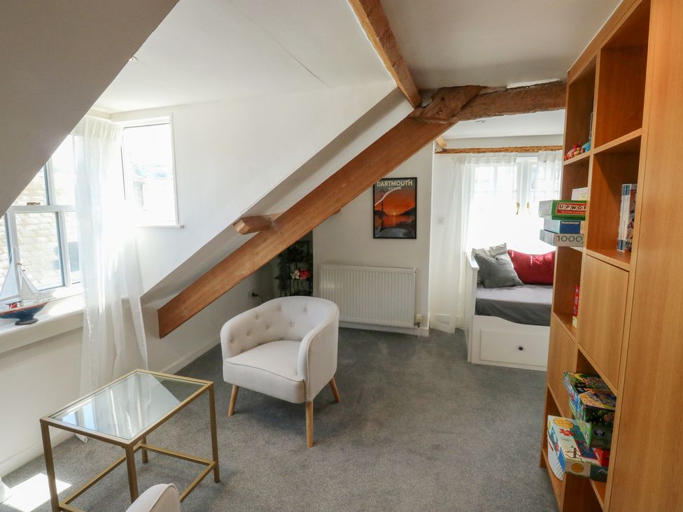 A living room with a chair and table at 15D Foss Street, Dartmouth