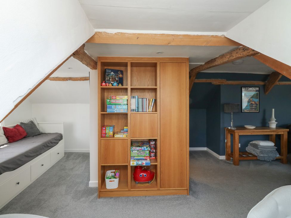 A room with a shelf filled with toys at 15D Foss Street Dartmouth