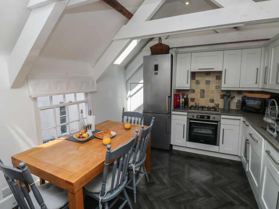A kitchen with a table and chairs at 15D Foss Street in Dartmouth
