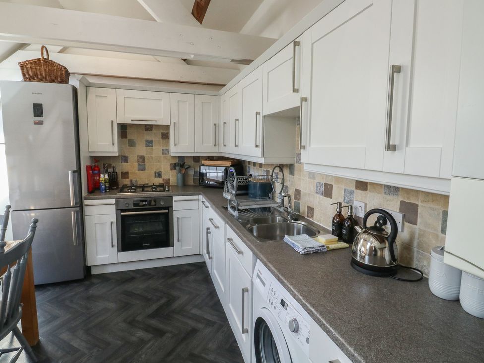 A kitchen with appliances and fixtures at 15D Foss Street in Dartmouth