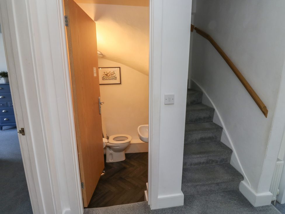 A bathroom with a toilet and door at 15D Foss Street Dartmouth