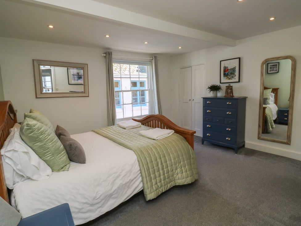 A bedroom with a bed and dresser at 15D Foss Street in Dartmouth