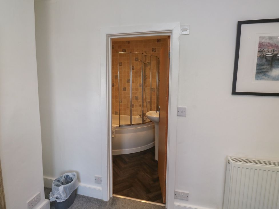 A bathroom with a bath and shower area at 15D Foss Street Dartmouth